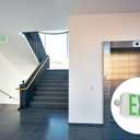 Lithonia Lighting Basics LED Exit Sign/Emergency Light Combo, Red/Green Switchable Exit Sign and Emergency Lights for Business, 2-Head Fixture, Round Lights, Remote Capacity, White (ECRG HO RD M6)