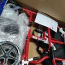 Medline Lightweight Foldable Transport Wheelchair with Handbrakes and 12-Inch Wheels, Red Frame, Black Upholstery