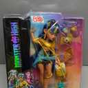 Monster High Cleo De Nile Doll in Golden Blouse & Layered Skirt, Includes Pet Cobra Hissette & Accessories Like a Backpack, Snack & Scroll (Multicolor)