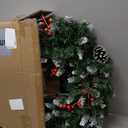 National Tree Company 24 in Pre-Lit Wintry Pine Artificial Christmas Wreath, Christmas Decoration with Pinecones, Red Berries, Snowy Bristle, 50 Clear Lights, 113 Tips, Green