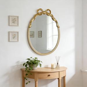 Oval Wall Mirror with Gold Finish, Iron Frame with Decorative Bow Design, Elegant Vintage Style
