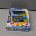 Hot Wheels RC Toy Car, Aston Martin Vantage, 1:64 Scale, Battery-Powered, Remote-Control Race Vehicle, Race On- & Off-Track, Booster Button for Speed