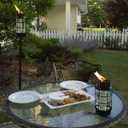 TIKI Outdoor Glass Lantern Torch Weather-Resistant Decorative Torch for Patio, Garden & Backyard with 4-Piece Adjustable Height Pole, Fiberglass Wick & Snuffer, Black