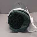 A queen-size green blanket with an all-over pattern.