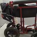 Medline Lightweight Foldable Transport Wheelchair with Handbrakes and 12-Inch Wheels, Red Frame, Black Upholstery