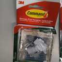 Command Outdoor Light Clips, 4 Pack of 16 Clear Clips and 20 Command Strips, Damage Free Hanging Light Clips with Adhesive Strips, Wall Clips for Hanging Outdoor Lights and Cables Outside (64 Clips)