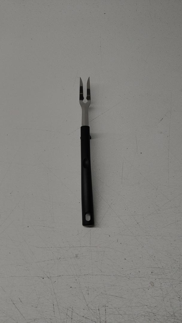 Stainless Steel Grilling Or BBQ Fork With A Black Handle