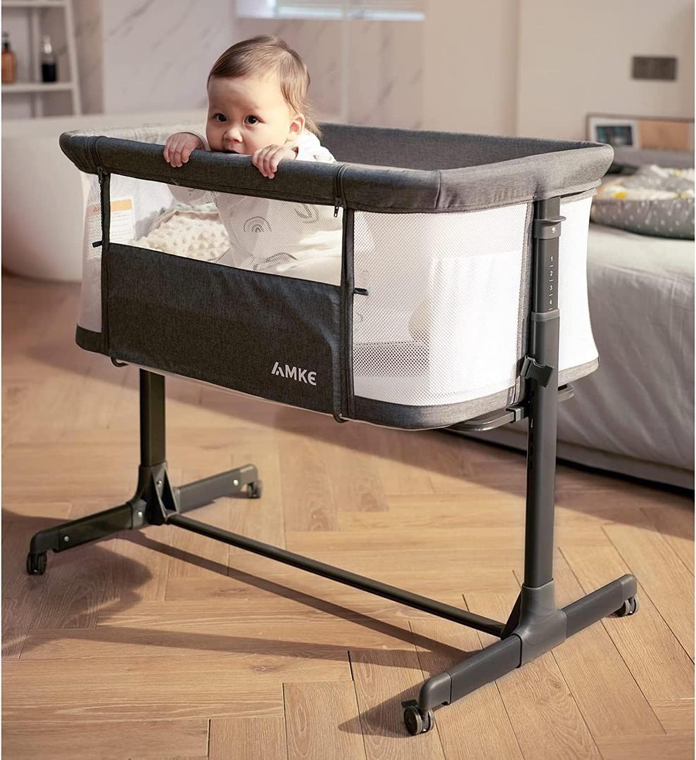 AMKE Baby Bassinet, Bedside Sleeper with Adjustable Height & Breathable Mesh, Portable Bassinet with Wheels, Easy Fold Design - Newborn Crib with Drop Down Side for Infants up to 20 Lbs (Dark Grey)