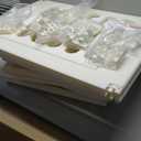 WHITE BABY CAGE ASSEMBLY KIT, WITH LOOSE PARTS.