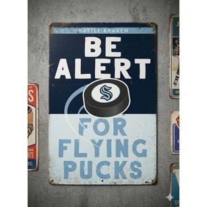 Seattle kraken be alert for pucks metal sign