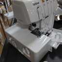 Brother Serger, 1034D, Heavy-Duty Metal Frame Overlock Machine, 1,300 Stitches Per Minute, Removeable Trim Trap, 3 Included Accessory Feet, White