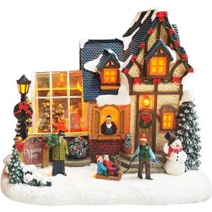 MOMENTS IN TIME Christmas Village Building Lighted Christmas Shop with LED Lights, Music & Snowman Battery Operated or Plug-in Vintage Holiday Village House Dcor 8.5H x 9.8W x 6.9D