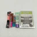 NYX PROFESSIONAL MAKEUP Thick It Stick It Thickening Brow Mascara. NYX Professional Makeup Lip IV Hydrating Glossy Lip Stain. e.l.f. Lip Exfoliator. L'Oréal Paris Makeup Magic Skin Beautifier BB Cream Tinted Moisturizer. Fox Cat Eye Lashes D Curl Las