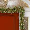 National Tree Company 9 ft Pre-Lit Crestwood Spruce Artificial Christmas Garland, Christmas Decoration with Glitter, Pinecones, Red Berries, 50 Clear Lights, 180 Tips, Green