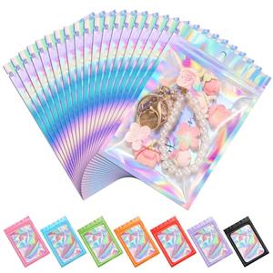 ANZNKU 100 Pack Mylar Bags Reasealable Holographic Bags, Smell Proof Bag Zipper Pouches with Clear Window, Jewelry Easter Candy Sealable Bag for Packaging Sample Party Favor (5.1 x 8.3 Inch)