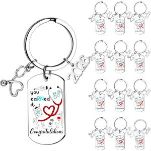 Nosiny 12 Pcs RN Nursing 2026 Graduation Party Favors Stainless RN Nurse Keychain Gifts Bulk for CNA Week Class of 2026 Nurse Graduation Keychain Gifts You Earned It CNA Nursing Party Favors Supplies