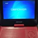 DBPOWER 11.5" Portable DVD Player, 5-Hour Built-in Rechargeable Battery, 9" Swivel Screen, Support CD/DVD/SD Card/USB, Remote Control, 1.8 Meter Car Charger, Power Adaptor and Car Headrest (Red)
