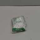 Clara Holding a Nutcracker Christmas Ornament