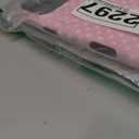 Pink Phone Case with White Heart Pattern and Black Camera Cutout.