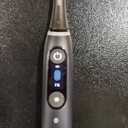 Oral-B iO Deep Clean + Protect Rechargeable Electric Toothbrush, Black with a iO Series 7 Toothbrush, 2 Replacement Brush Heads, and a Charging Travel Case