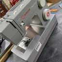 SINGER Heavy Duty Holiday Bundle  4452 Sewing Machine with Extension Table & 2 Presser Feet | Strong Motor, 110 Stitch Applications, Full Metal Frame, 1-Step Buttonhole & LED Light