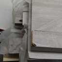 Low Twin Over Twin Size Bed Floor Bunk Bed with Panelled Headboard Footboard, Ladder and Guardrails, Solid Rubber Wood Frame