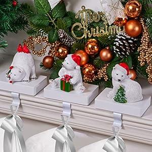 UNIQOOO Champagne Gold HoHoHo Christmas Stocking Holder Set of 3, Max 2Lb, Heavy Duty, Padded Grip Bottom, White Christmas Mantel Hooks Fireplace Garlands Wreath Decoration Hanger, w/Bells Ribbon