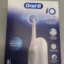 Oral-B Rechargeable Electric Toothbrush, iO Limited Simple Clean, 3 Cleaning Modes, Automatic Pressure Sensor to Protect Gums, Travel Case, White