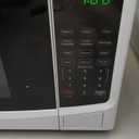 Farberware 0.9 Cu. Ft. Countertop Microwave Oven  900W Power, Auto Cook Settings, Defrost, and Safety Lock  White