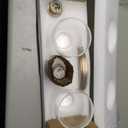 Kichler Meller 24.25 Inch 3 Light Vanity Light with Clear Glass Shades in Champagne Bronze for Bathroom or Powder Room, (24.25" W x 11.25" H x 7" D) 55102CPZ