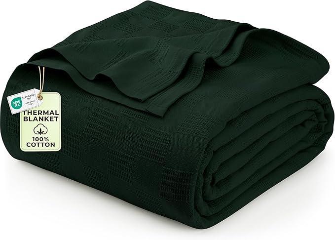 A queen-size green blanket with an all-over pattern.