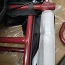 Medline Lightweight Foldable Transport Wheelchair with Handbrakes and 12-Inch Wheels, Red Frame, Black Upholstery