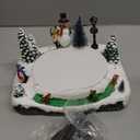 Animated Christmas Village Skating Pond - Lighted Musical Snow Scene with 4 Moving Skaters, Adapter, Battery Slot
