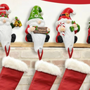 Glitzhome Christmas Stocking Holders, Set of 4 Santa Snowman Penguin Mantel Decor with Weighted Base, Festive Jack-in-The-Box Design for Fireplace, Holiday Sock Hangers