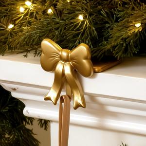 MorningRo 4 Pcs Gold Bow Christmas Stocking Holder Heavy Duty Cast Iron Gold Christmas Bow Stocking Holder Xmas Home Metal Decoration for Mantle Fireplace Shelf Staircase Decoration(Classic)