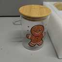 Suclain 4 Pcs Christmas Glass Storage Jars 24 oz Xmas Candy Cookie Jar Containers with Airtight Lids Spoons Santa Snowman Reindeer Gingerbread Man Decorative Canisters for Home Kitchen Countertop