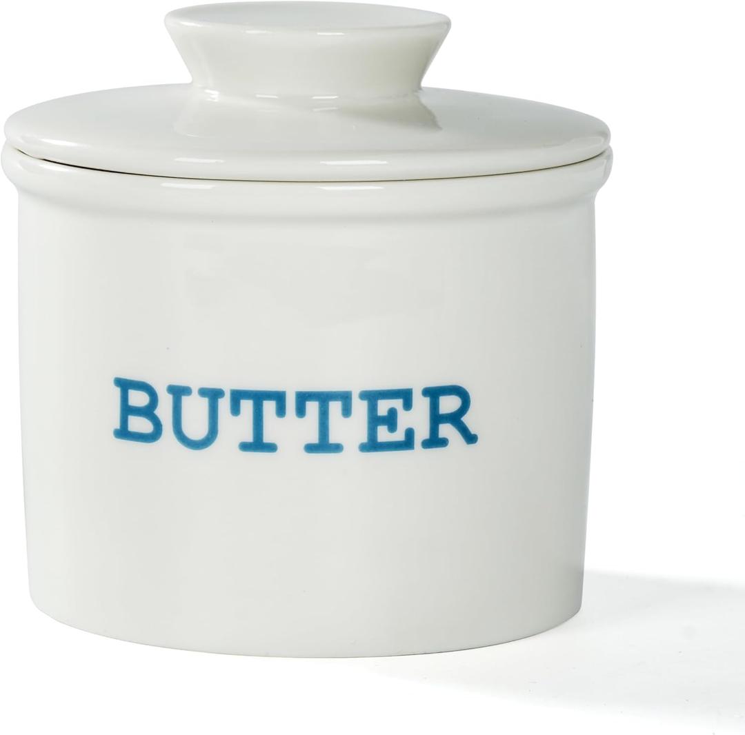 Apollo's Kitchen French ceramic butter crock with a water seal, white glossy color, with a red butter spreader. For soft spreadable butter