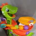 Move2Play, Air-Powered Dinosaur Ball Popper | 30+ Songs, Sayings, & Lights | Baby & Toddler Toys Ages 6 7 8 9 10 12+ Months | Boy & Girl Gift for 1, 2+ Year Olds | Birthday Present