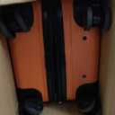 Amazon Basics 21" Hardside Carry-On Luggage with Spinner Wheels, Expandable for Up to 25% More Space, Scratch-Resistant Hardshell Suitcase, Telescoping Handle, Orange